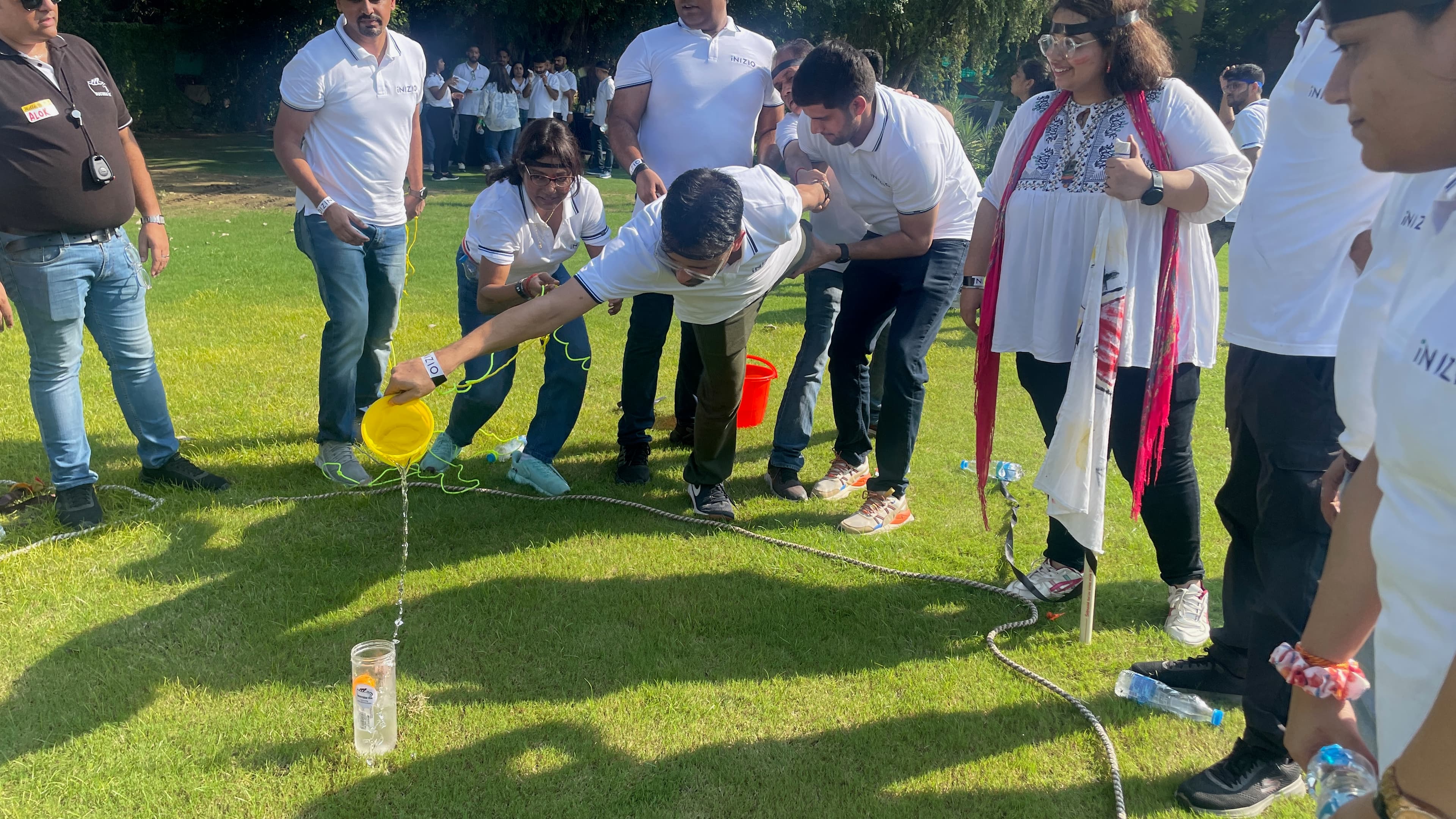 Team members solving an outdoor collaboration challenge